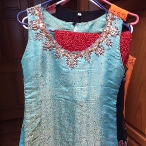 Light blue with red pants